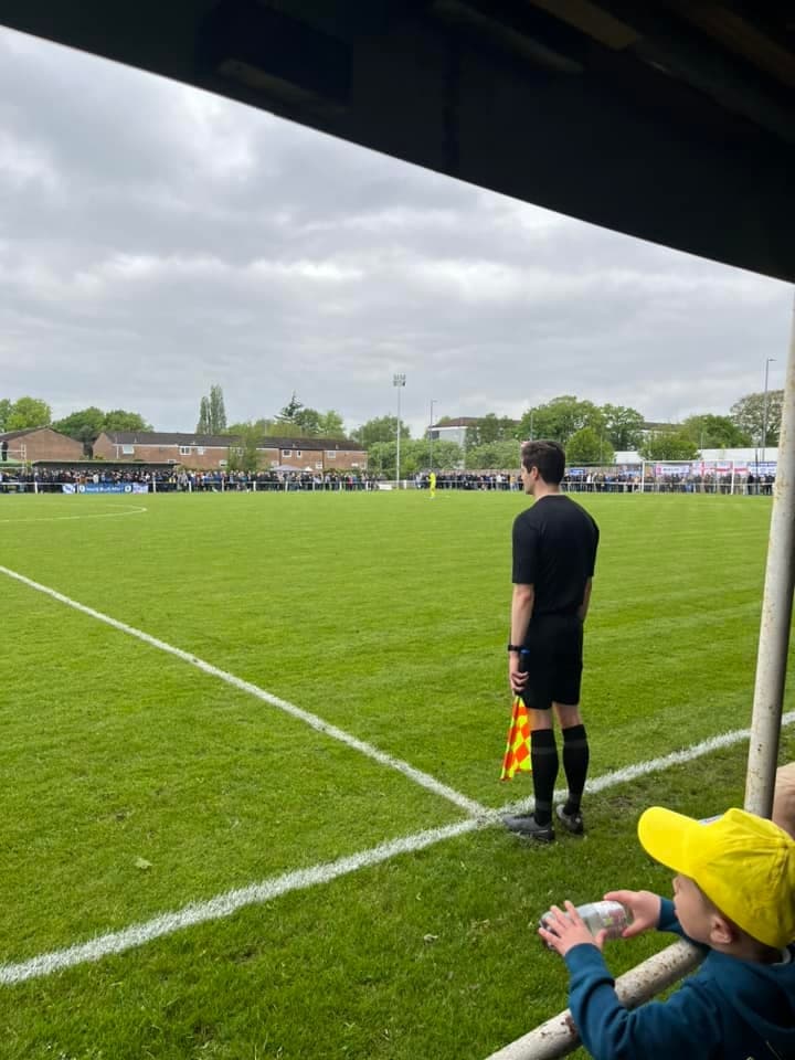 Two referees standing together before a match